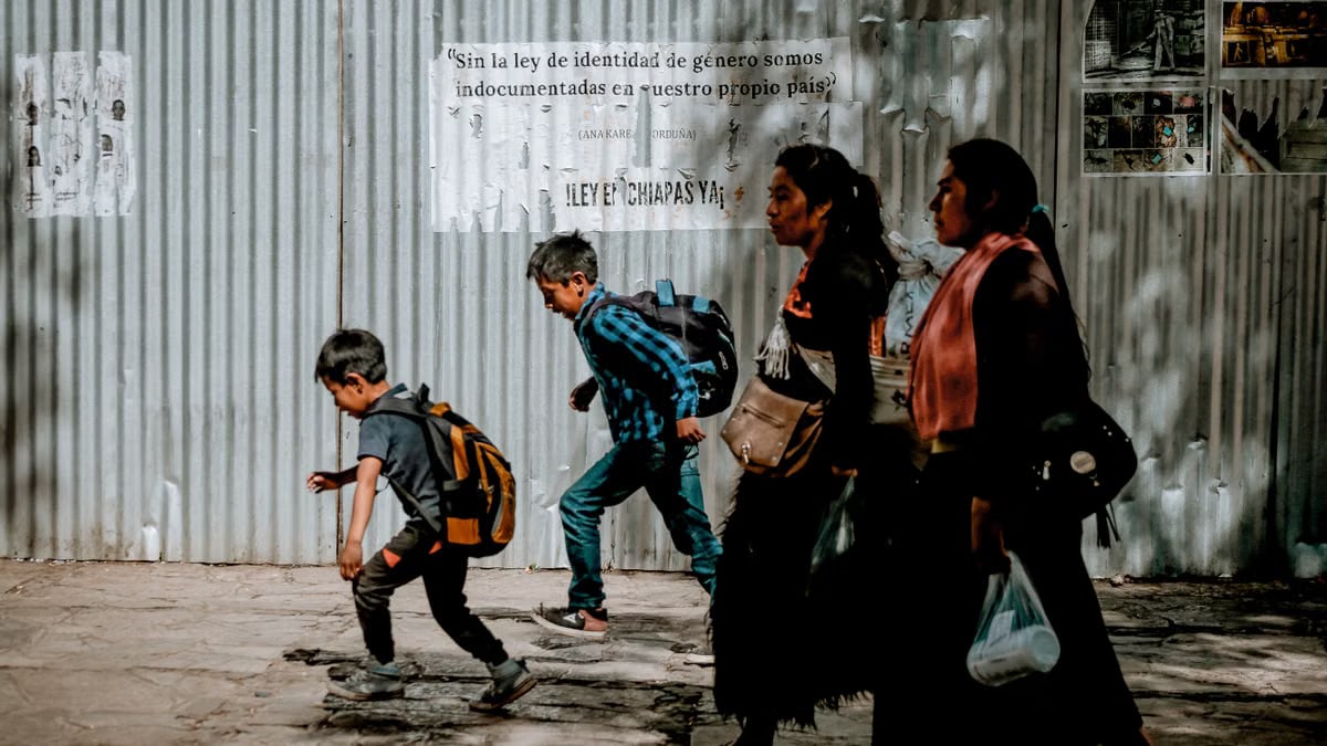 Family walking through shaded streets of San Cristóbal, Chiapas.